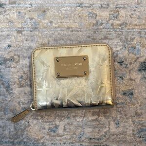 Michael Kors Gold Wallet with Zipper Closure and Textured Material